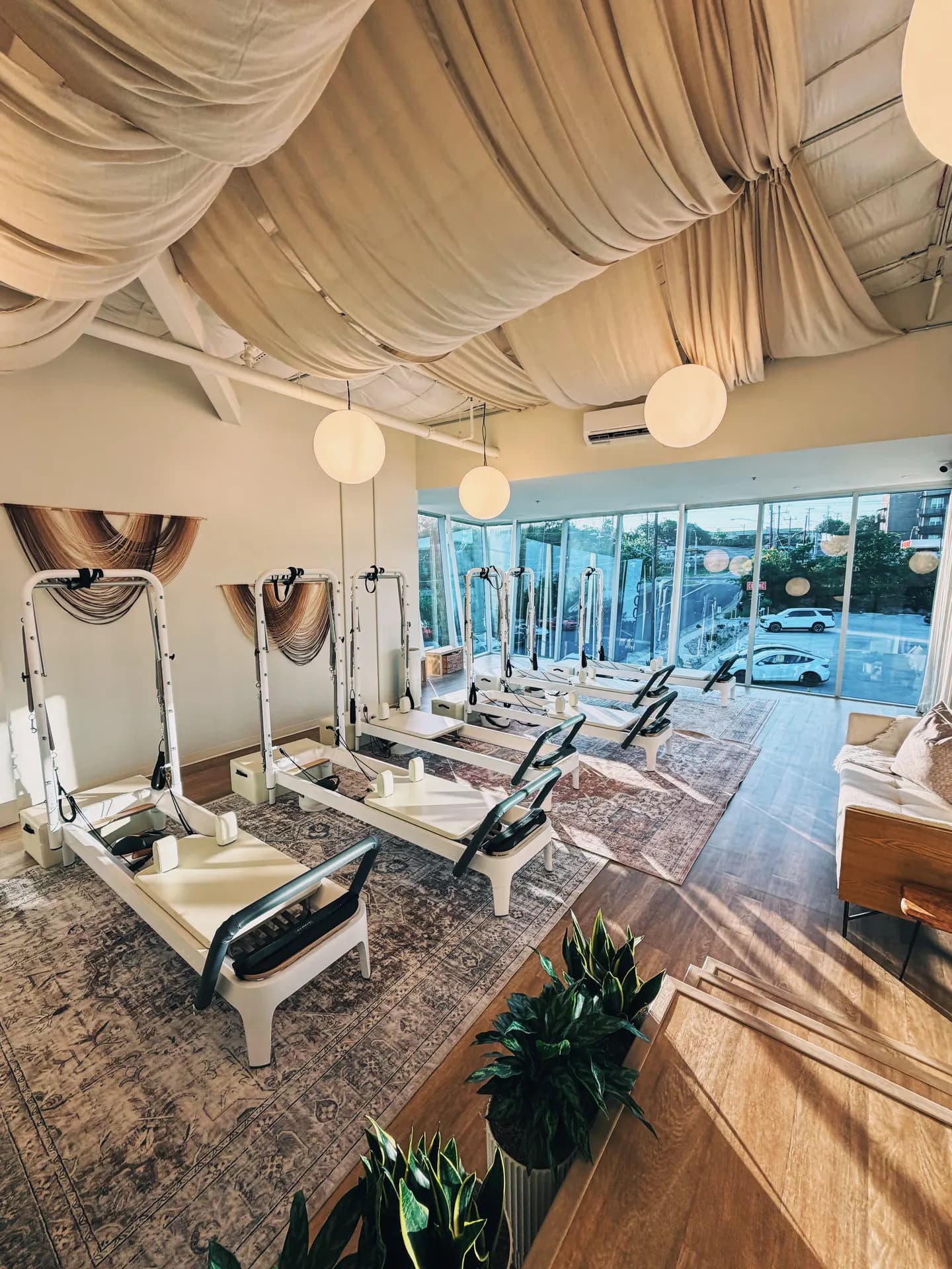 The sunlit Reformer Pilates studio at THIS Gym