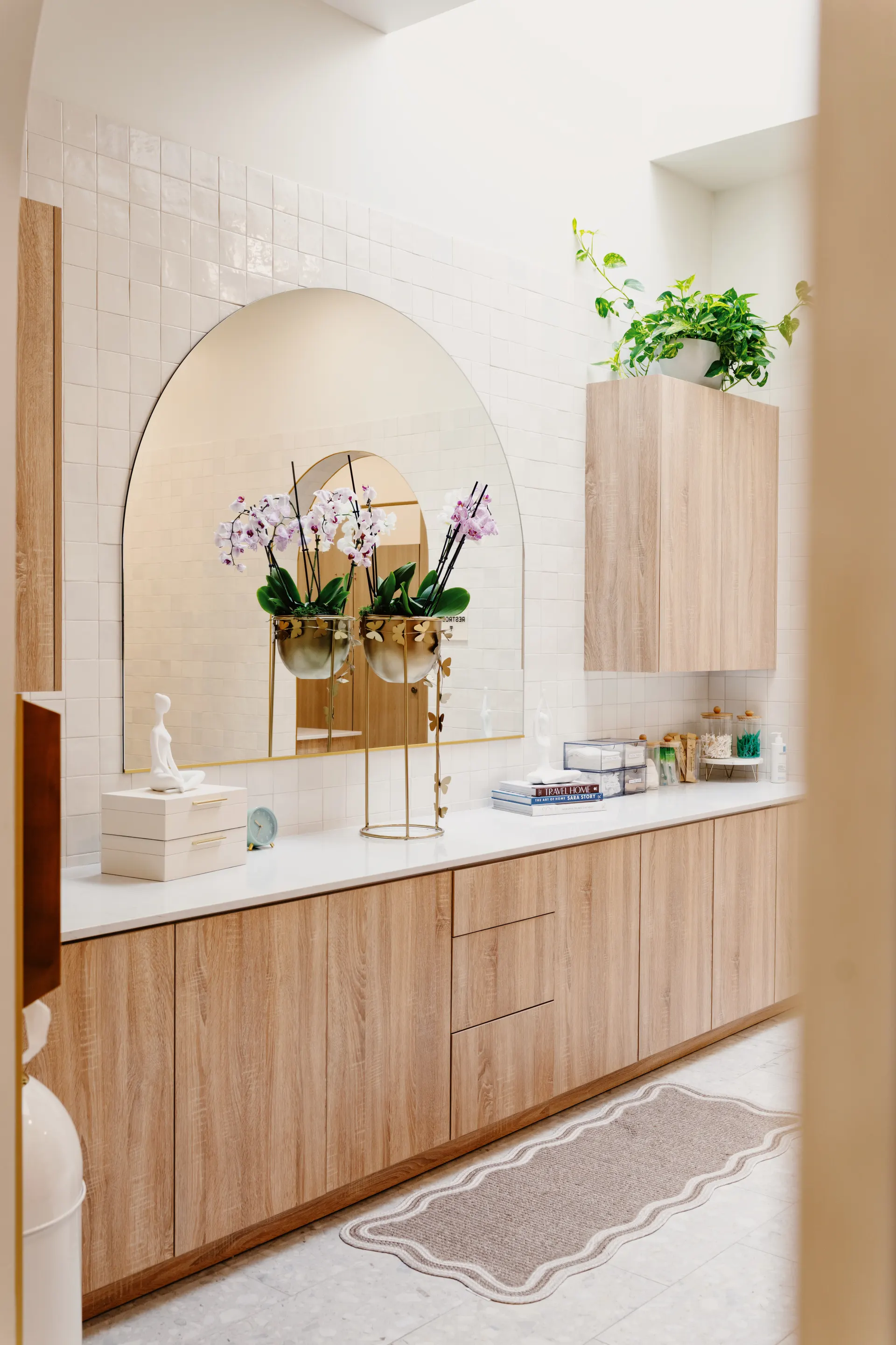 The women's locker room at THIS Gym — vanities, personal lockers, and private showers — image 2 of 3