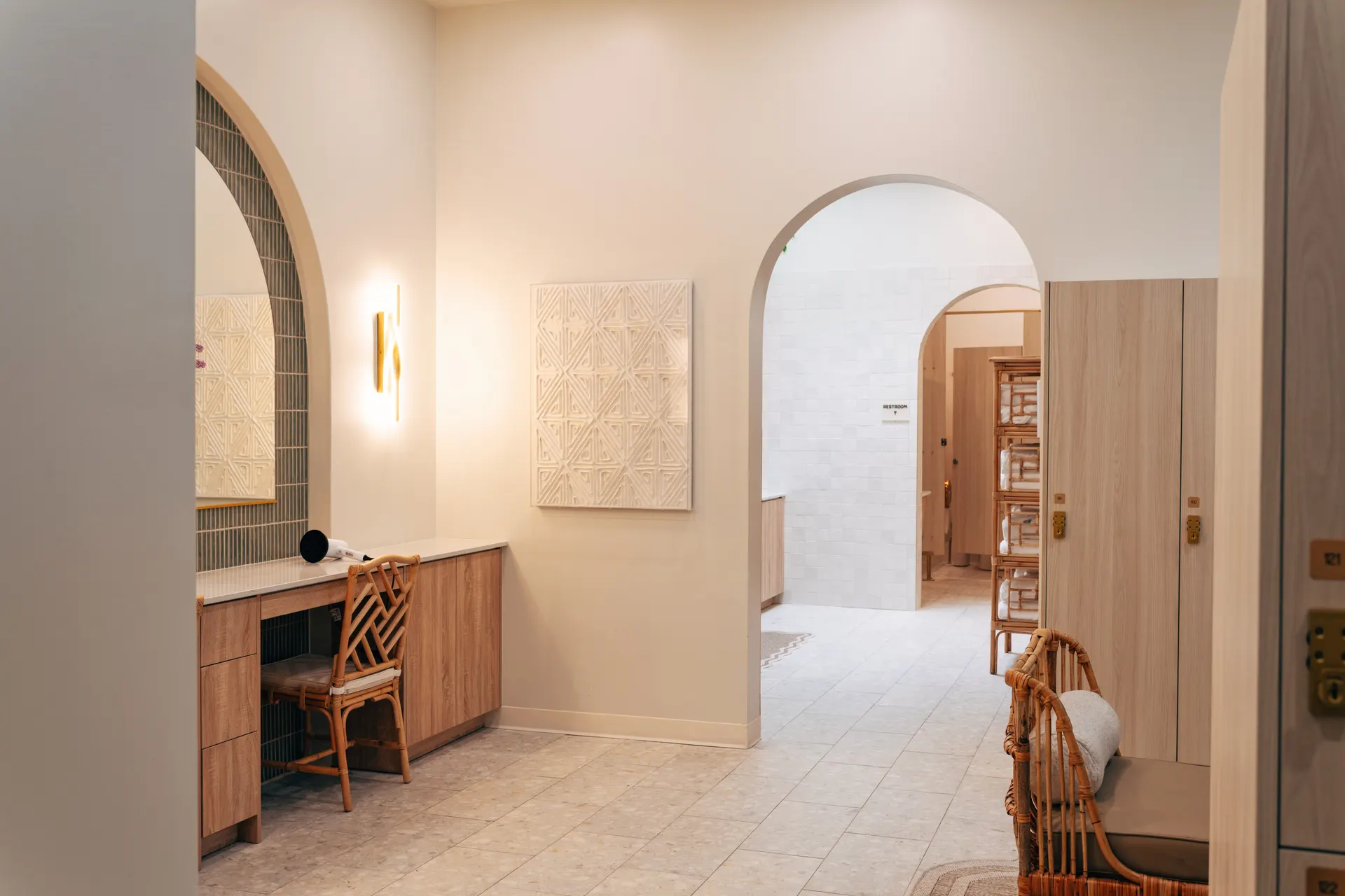 The women's locker room at THIS Gym — vanities, personal lockers, and private showers — image 1 of 3