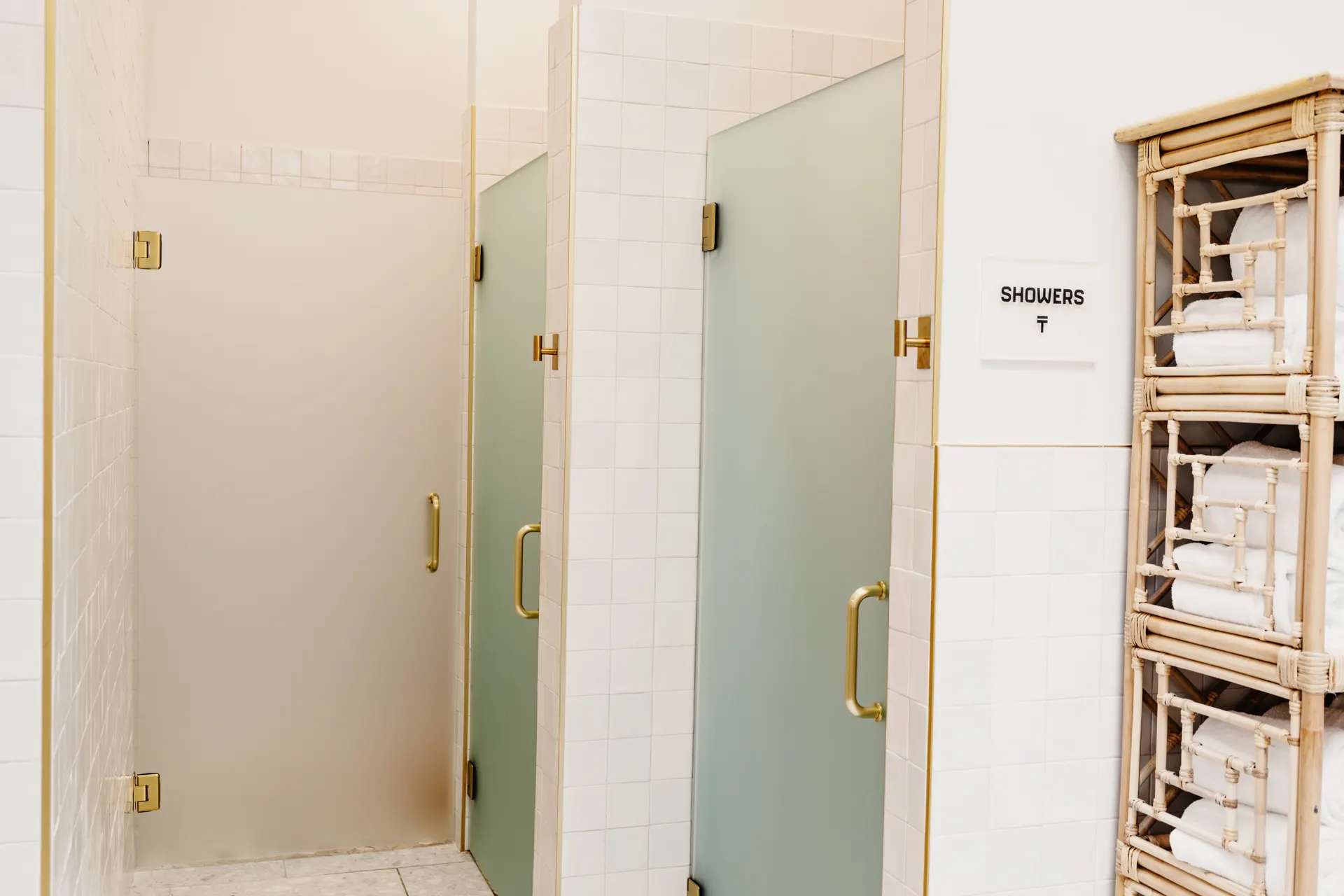 The women's locker room at THIS Gym — vanities, personal lockers, and private showers — image 3 of 3